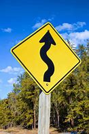 Image result for Windinf Road Sign