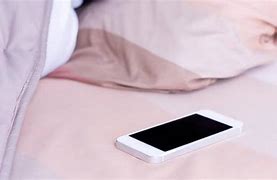 Image result for Person Shopping On iPhone in Bed