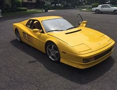 Image result for 90s Yellow Ferrari