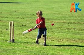 Image result for Picture of a Child Holding a Cricket Ball