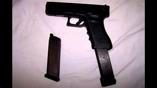 Image result for Pistol with Extended Clip