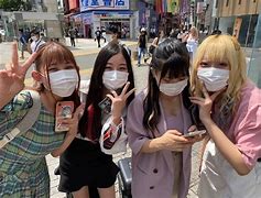 Image result for People in Tokyo Fighting to Get On the Train