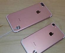 Image result for iPhone 7 Plus Rose Gold in Hand