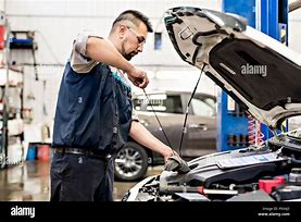 Image result for Men Working On Cars
