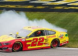 Image result for Joey Logano Wearing a NASCAR Hat