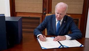 Image result for Biden signs foreign aid bill