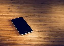 Image result for iphone on a tables