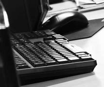Image result for Wahite Keyboard with Black Desk