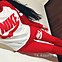 Image result for Red Trainers Blue Tracksuit