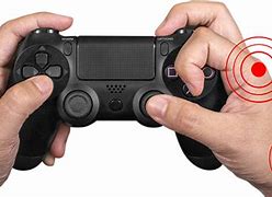 Image result for Holding PS4 Controller