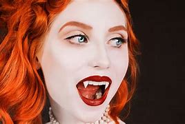 Image result for Extremely Long Vampire Fangs