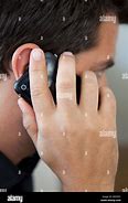 Image result for Perosn Holding Flip Phone to Ear