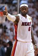 Image result for LeBron James Miami Heat Holding Trophy