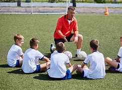 Image result for football coach and players