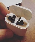 Image result for An iPhone with AirPod Case On Top