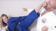 Image result for Woman Karate Kicking Man