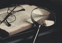 Image result for Book with Magnifying Glass