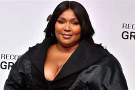 Image result for Lizzo Singing with Mirophone