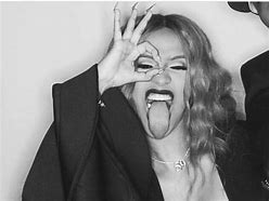 Image result for Cardi B with Yellow Hair and Black and White Suit