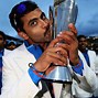 Image result for Dhoni with Trophy