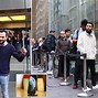 Image result for Photo of Someone Buying the Latest iPhone