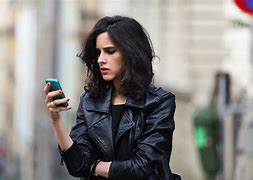 Image result for Model Looking at Phone