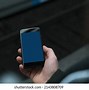 Image result for Man Holding iPhone 13