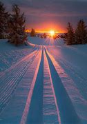 Image result for Snow-Covered Mountains at Sunset