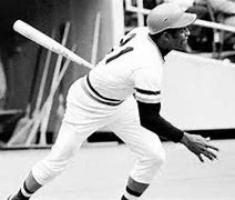 Image result for Roberto Clemente Holding Two Bats