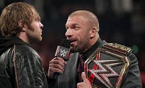 Image result for Dean Ambrose Grabs Triple H Nose