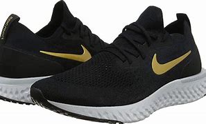 Image result for Black Nike with Gold Swoosh