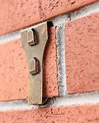 Image result for Hooks That Stick On Brick