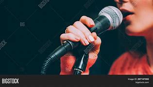 Image result for Singer with iPad On Microphone