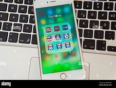 Image result for iPhone with News Media Logos Coming Out of It