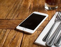 Image result for Mobile Phone in Table
