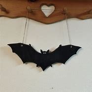 Image result for Bat Hanging On Wall