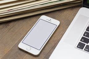 Image result for iPhone On Desk Luxury Stock-Photo