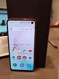 Image result for Phone On Wooden Table