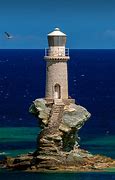 Image result for Tourlitis Lighthouse Off the Coast of Andros Island Greece Sunset