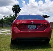 Image result for Red Toyota Corolla Cockroach