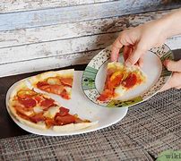 Image result for How to Eat Pizza