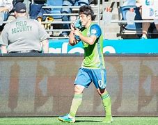 Image result for Sounders Holding Shoe as Phone