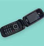 Image result for Old Flip Phone with Front Buttons and Keyboard