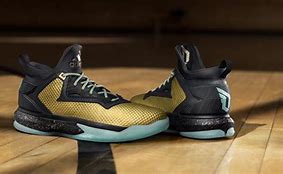 Image result for Damian Lillard Gold Shoes