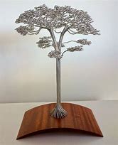 Image result for Wood Sculpture and Plant
