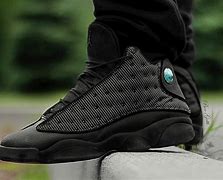 Image result for Jordan 4 Black Cat On Feet