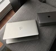 Image result for MacBook Pro 14 Space Grey vs Silver