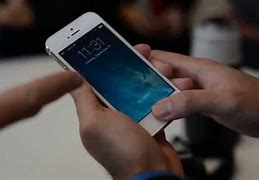 Image result for iPhone 5S in Kid Hands