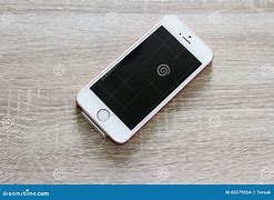 Image result for Phone On Wooden Table