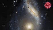 Just two distant spiral galaxies,... - Hubble Space Telescope